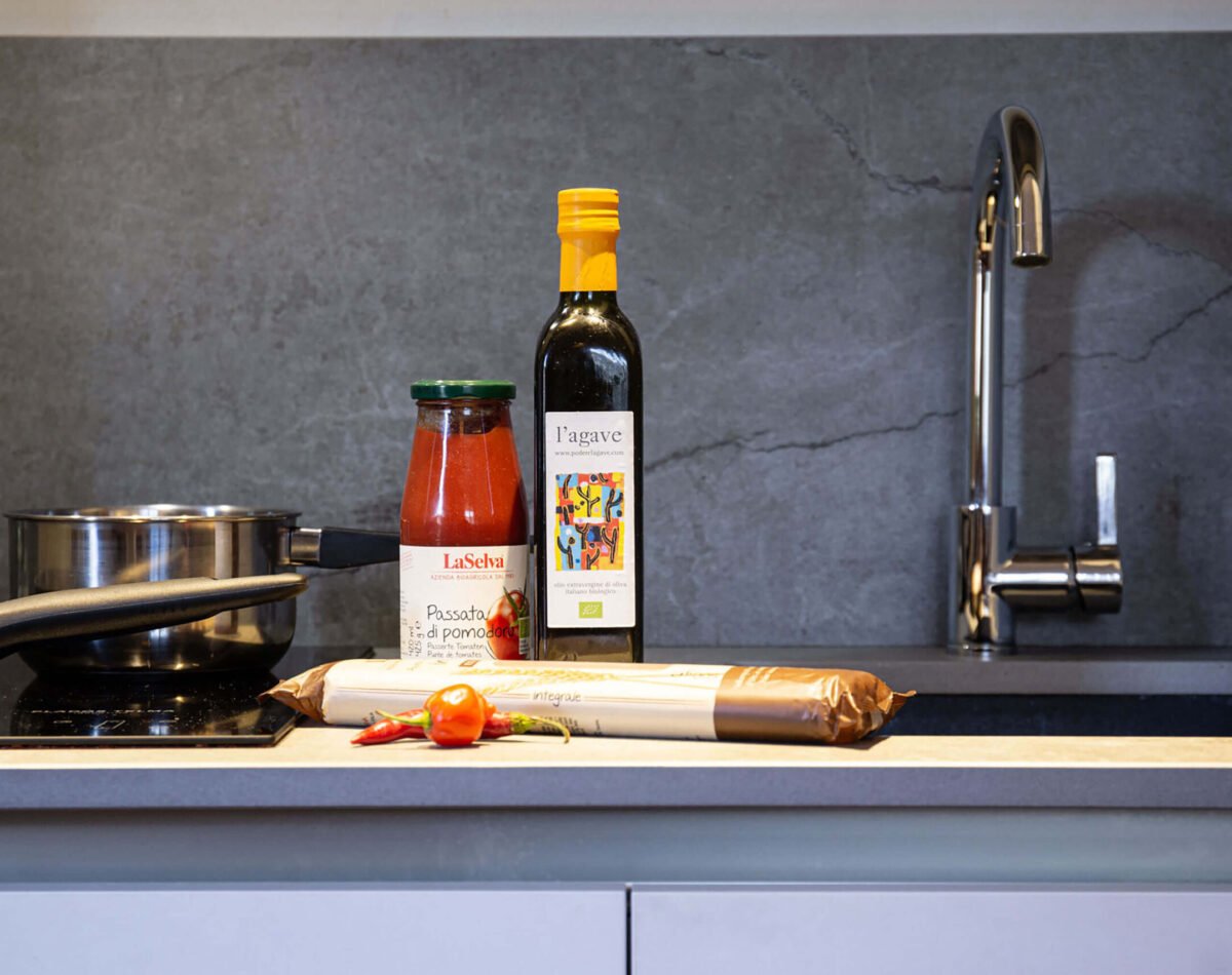 tuscan products pasta, olive oil and tomato sauce to cook