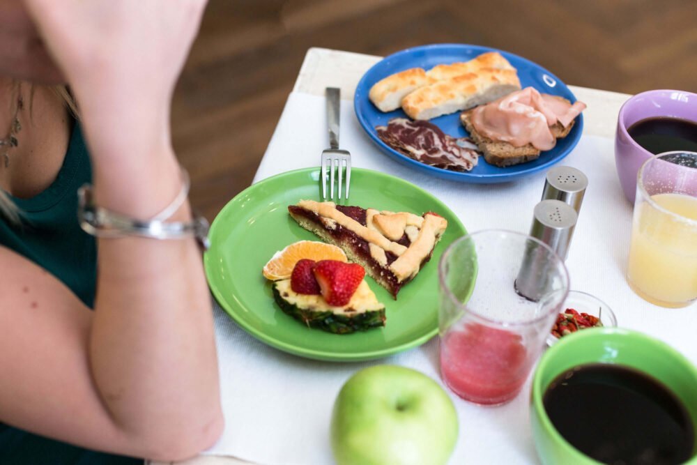 breakfast with flat bread fruits and black coffee at agave in città livorno