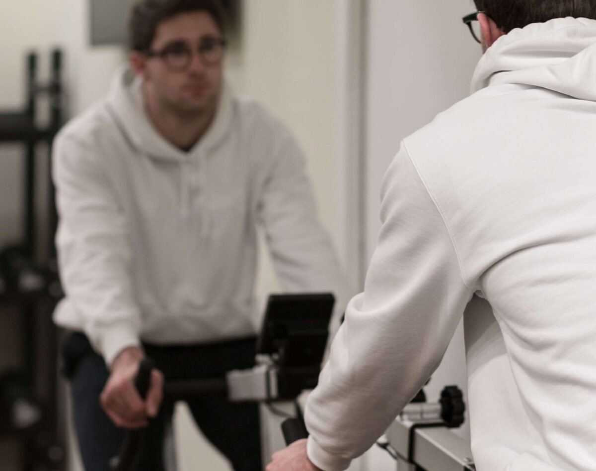 boy working out on cyclette in hotel with gym always open