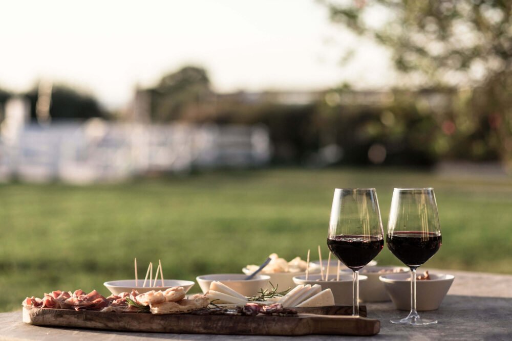 organic aperitivo with ham and chees and tuscan red wine