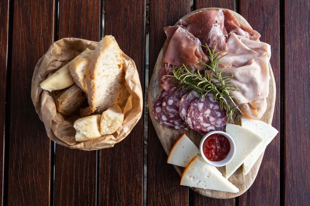 charcuterie board with frfesh bread and home made jam