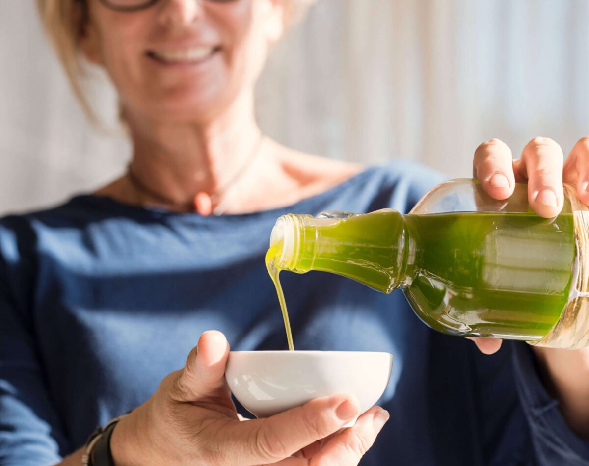 our founder pouring our organic olive oil