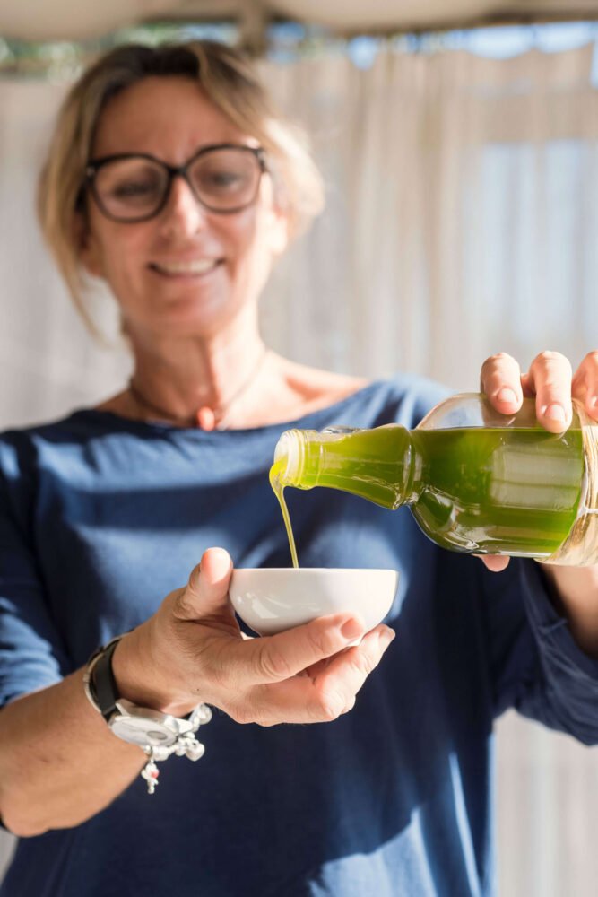 our founder pouring our organic olive oil