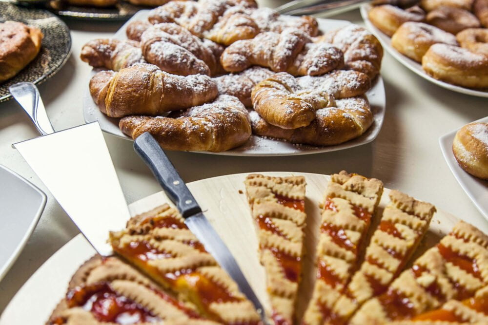 breakfast with home made cakes croissants and