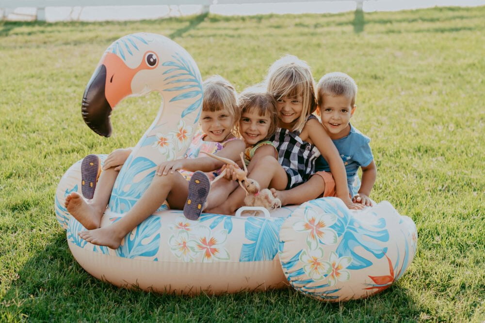 kids on a inflatable flaming by the lawn at podere l'agave San Vincenzo