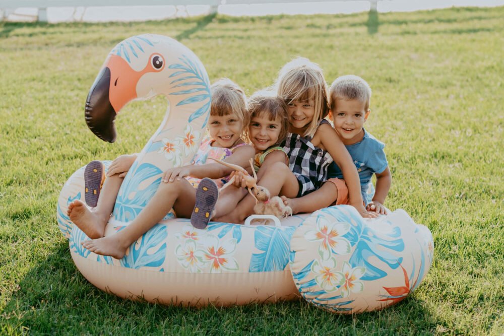kids on a inflatable flaming by the lawn at podere l'agave San Vincenzo