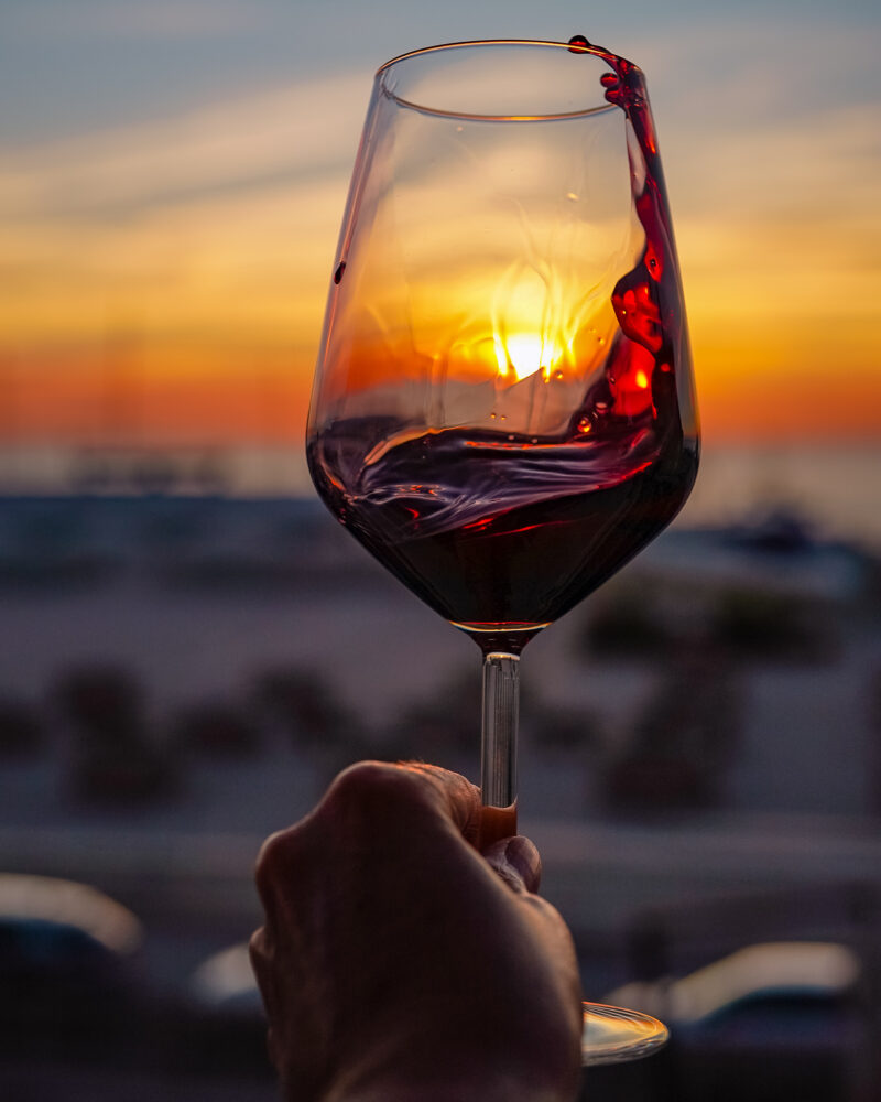 glass of red wine at sunset at Residenza Santa Cecilia San Vincenzo